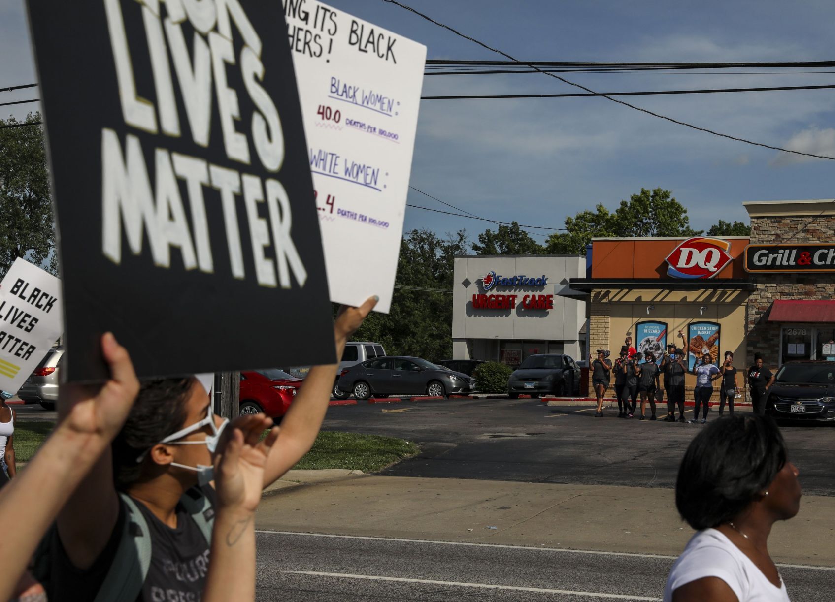 Protesters march down Highway 67
